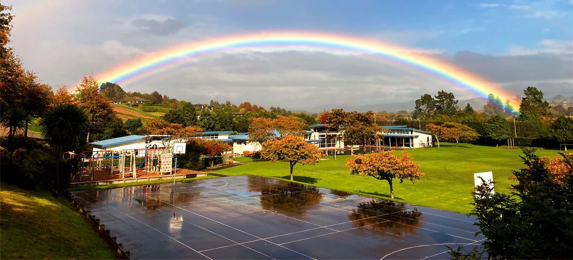 Rainbow over an Adventist school campus
